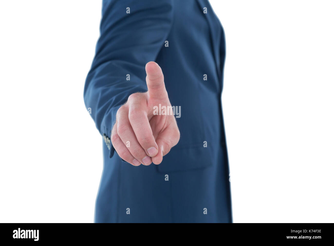 Mid section businessman using invisible imaginary interface while standing against white background Stock Photo