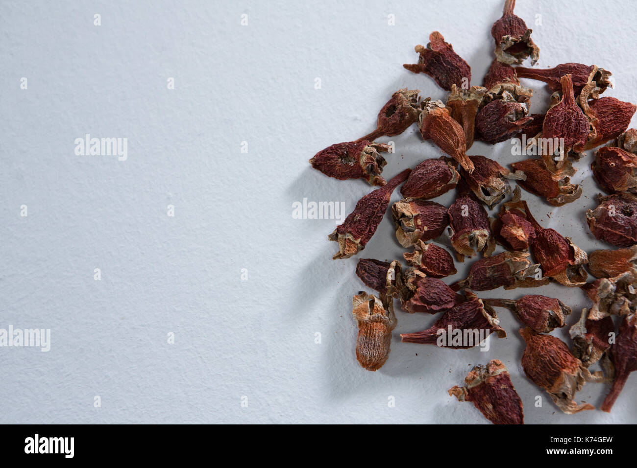 Overhead of dried berries on white background Stock Photo - Alamy