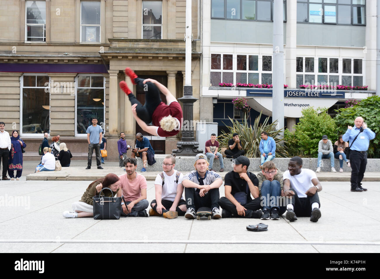 Urban acrobat, jumping a group of 7. Stock Photo