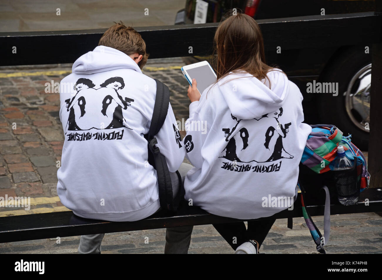 Couple in saucy hoodies, London, Stock Photo
