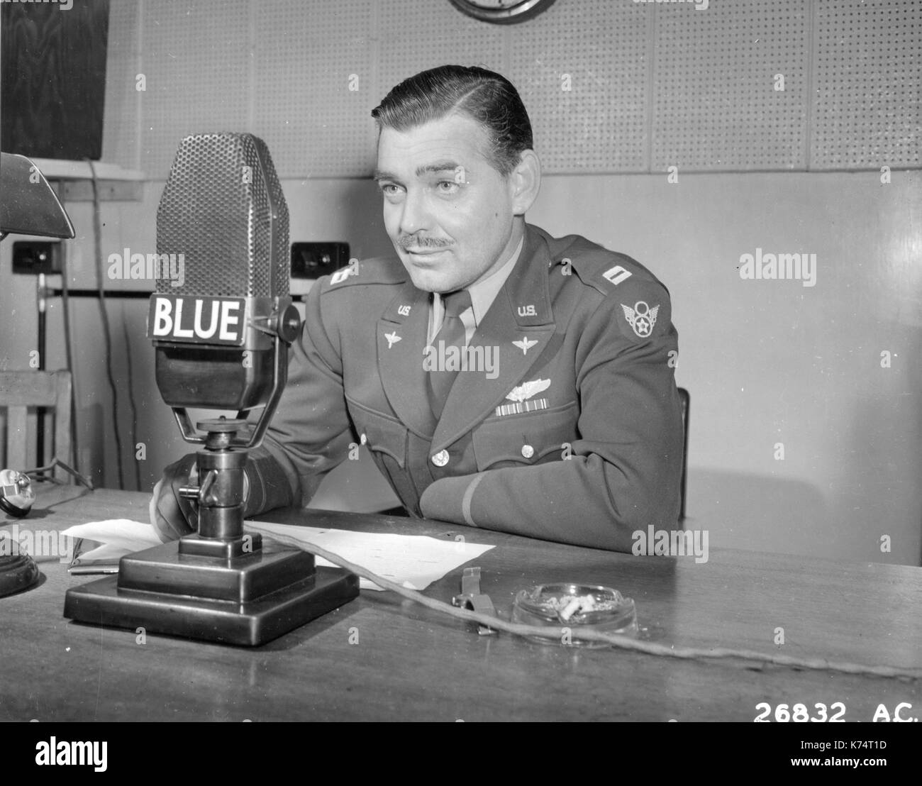 US Army Air Corps Capt Clark Gable broadcasts to America from England to urge the purchase of War Bonds in support of the 3rd War Loan Drive program, England, 1943. Stock Photo