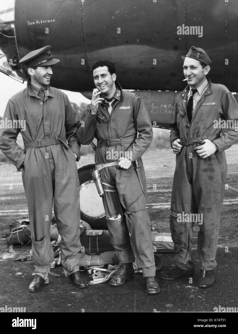 CBS newsman Edward R Murrow (left) is shown after his return from his fourth Marauder mission over France with Lt Col Harry G. Hankey (center), group deputy commander and Gene Rider, CBS technician (right), England, 1943. Stock Photo