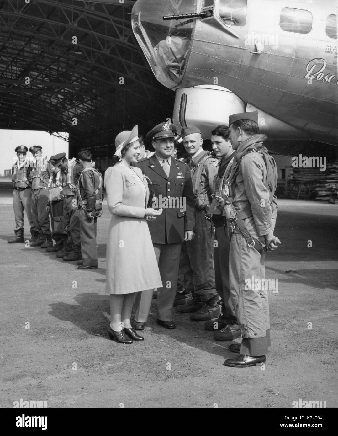 Princess Elizabeth chats with crew at the christening of the Boeing B-17 Flying Fortress 'Rose of York' at a base somewhere in England, England, 7/6/1944. Stock Photo