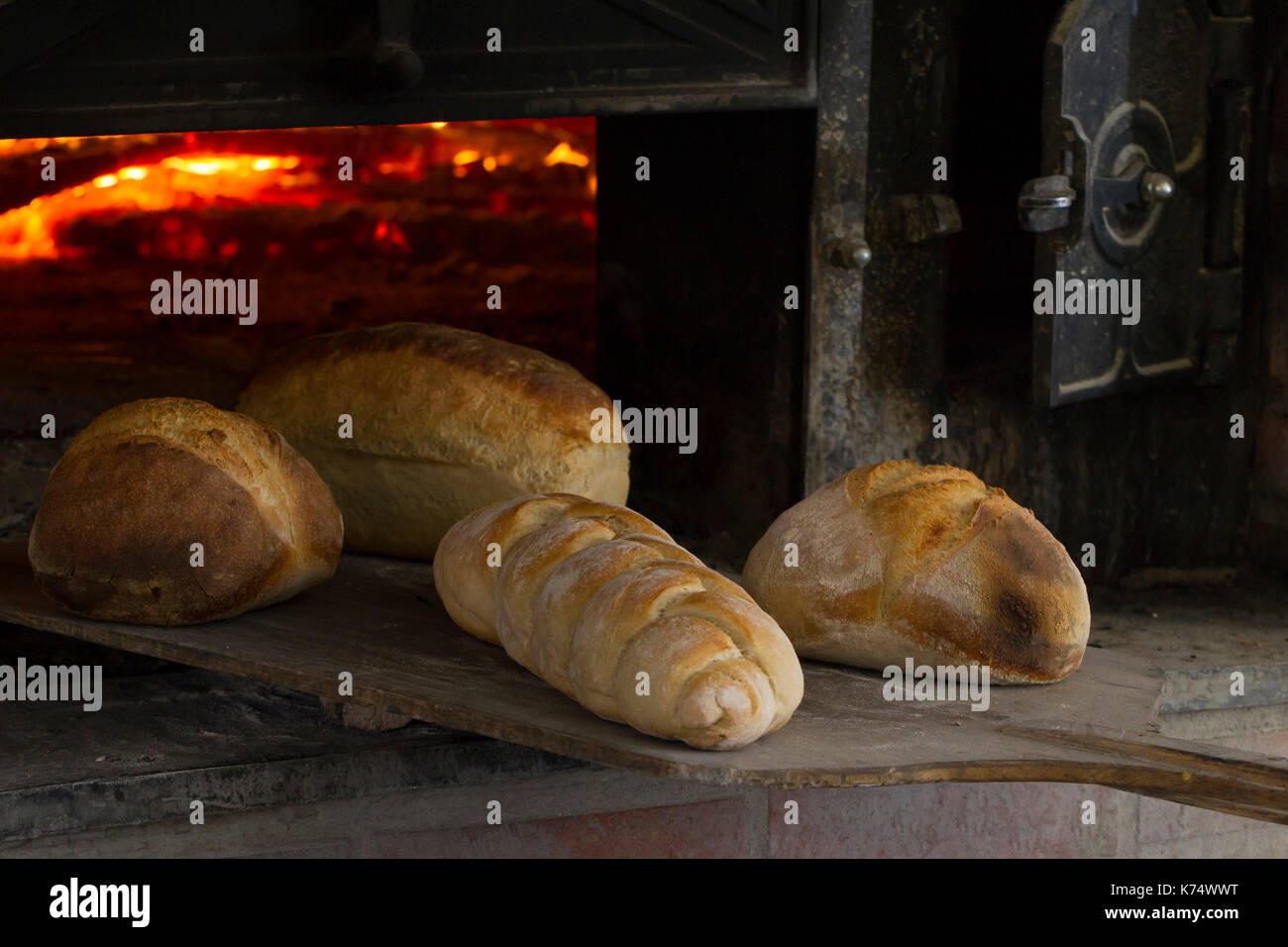 Bakery breads baked in a woodfired oven Stock Photo Alamy
