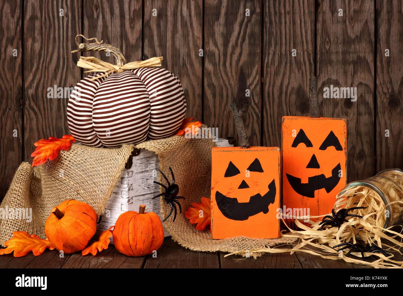 Rustic shabby chic Halloween decor against an old wood background ...