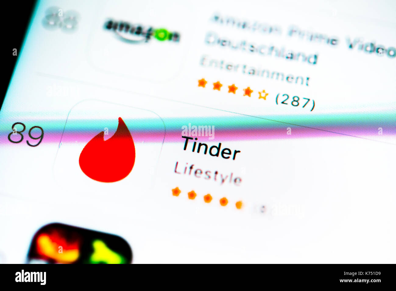 Tinder, Dating App in the Apple App Store, Mobile Game, Virtual Reality, Game, App-Icon, Display on a screen of a mobile phone Stock Photo