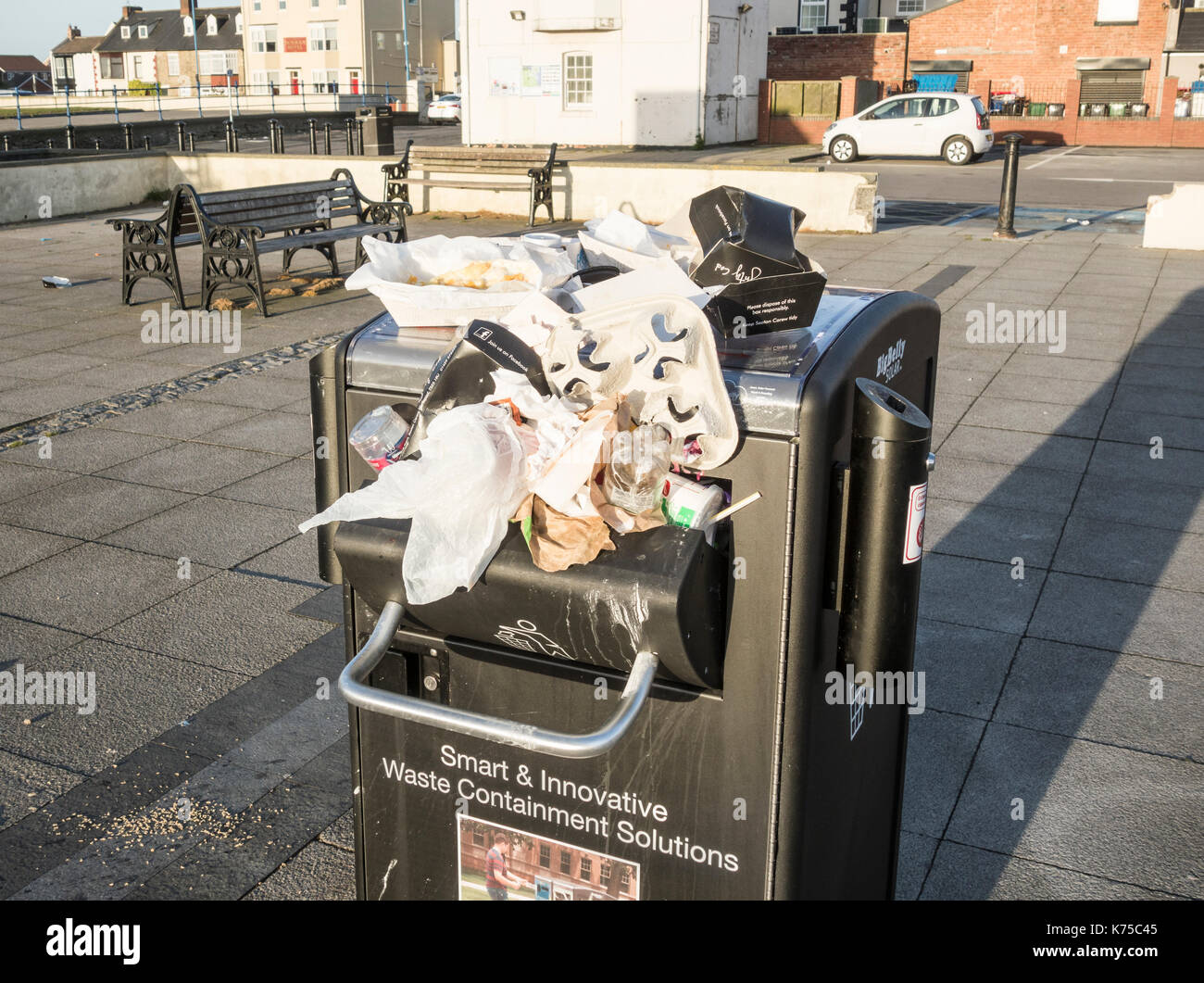 Overflowing solar powered "Bigbelly" litter bins full of Fish & Chip