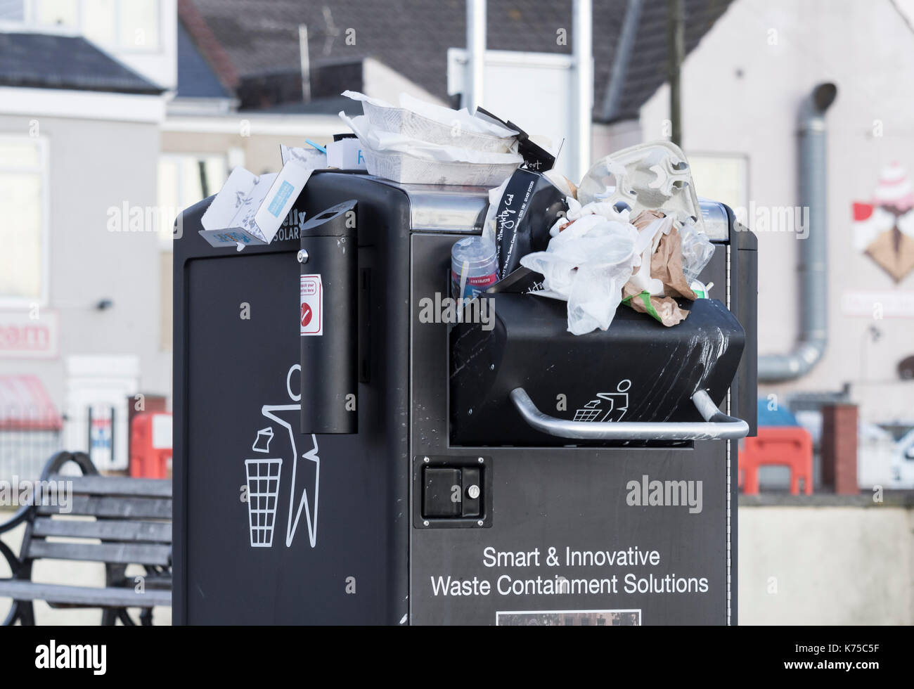 Overflowing solar powered "Bigbelly" litter bins full of Fish & Chip