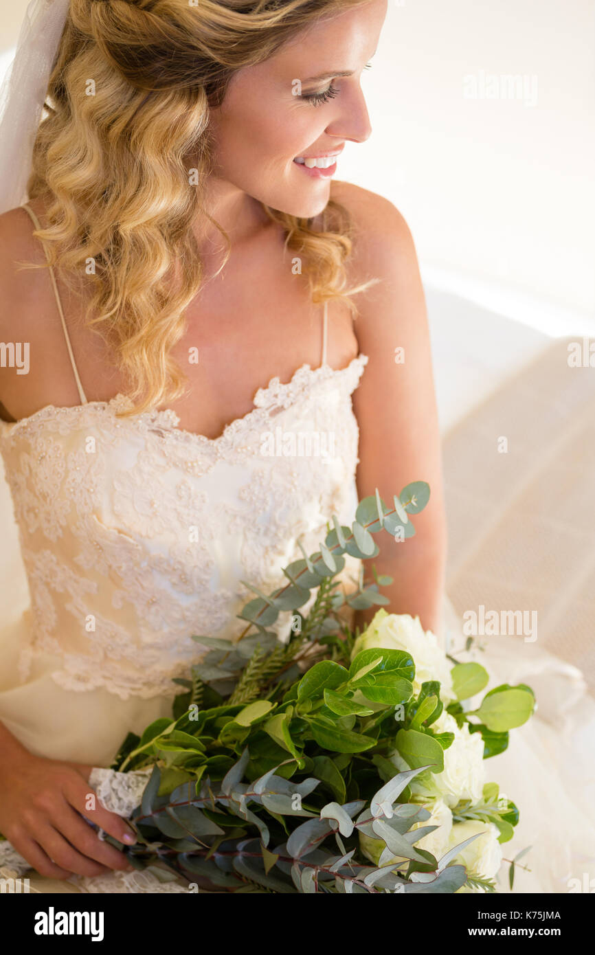 Smiling bride holding bouquet hi-res stock photography and images - Alamy