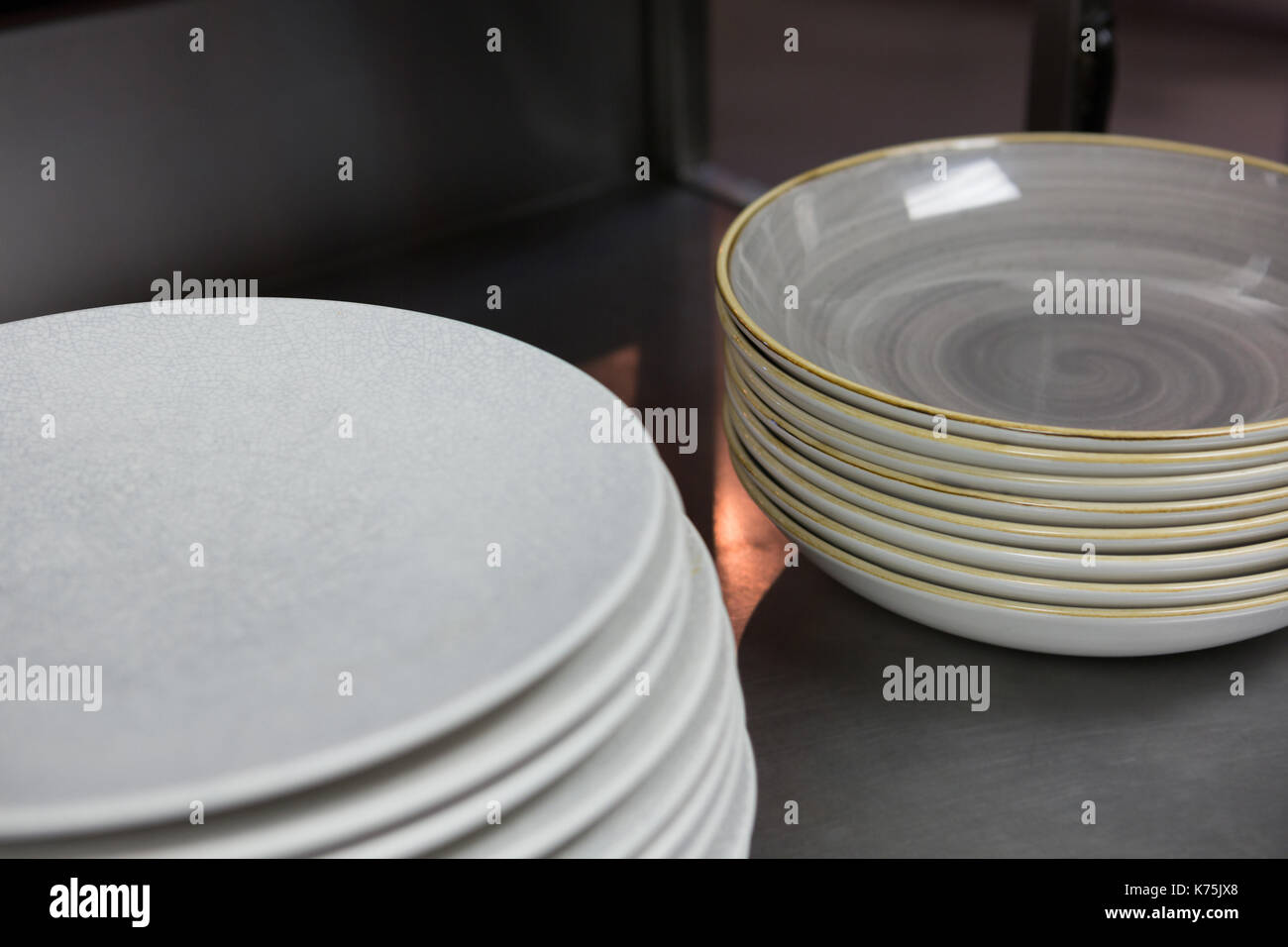 Stack of plates in restaurant hires stock photography and images Alamy