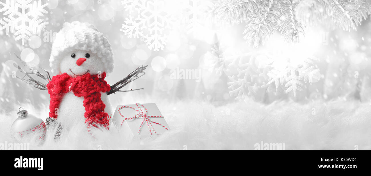 Snowman in winter setting,Christmas background. Stock Photo