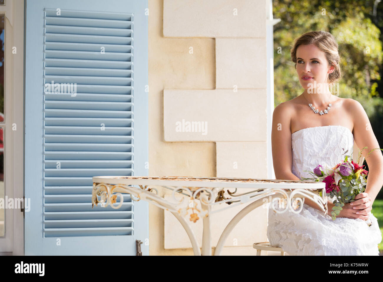 Bride sitting on chair hi-res stock photography and images - Alamy