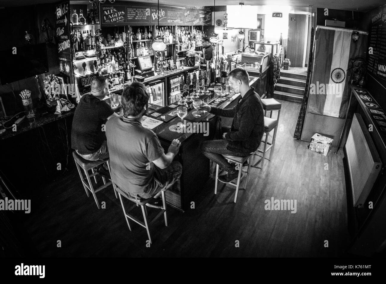 Daytime drinkers inside The Peacock bar in the independent area of North Parade, Bradford. Stock Photo