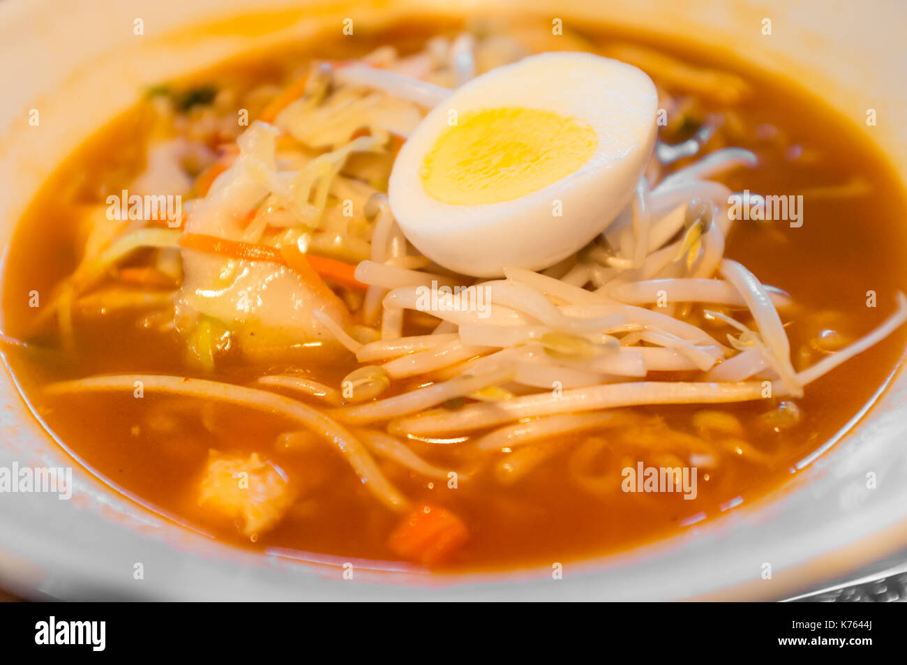 Spicy Korean ramen with mung bean sprouts and hard boiled egg Stock
