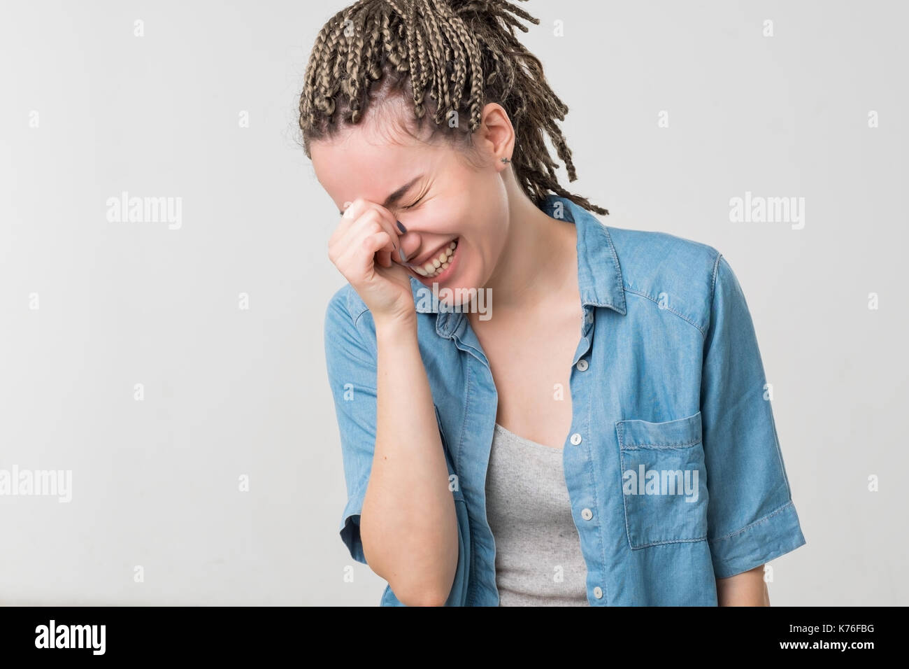 Close up portrait of a beautiful mid adult woman laughing with sweater Stock Photo