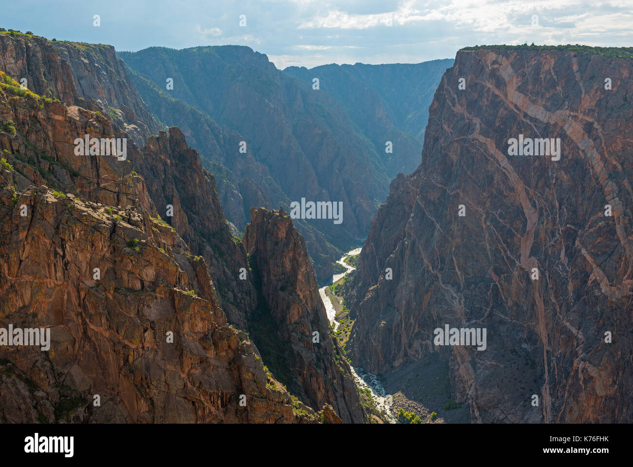 The granite cliffs of the Black Canyon of the Gunnison with the two dragons and the mysterious Gunnison River cutting through the rock, Colorado, USA. Stock Photo