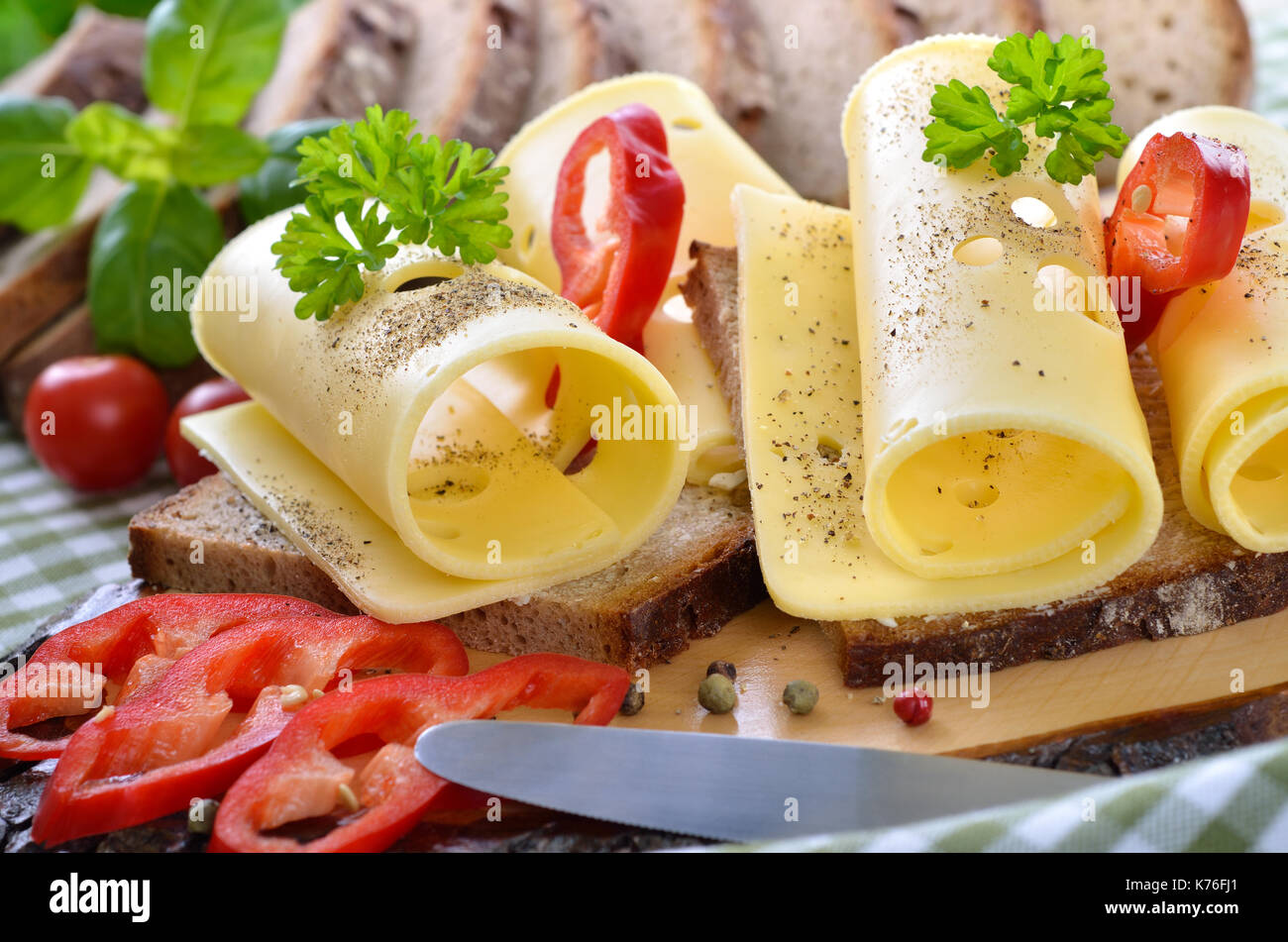 Snack with Swiss cheese on buttered ryewheat bread Stock Photo Alamy