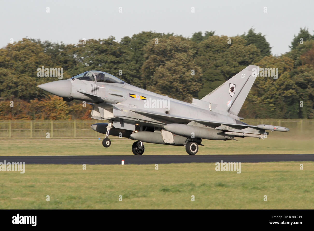 11 Squadron RAF Typhoon landing at RAF Coningsby in the late afternoon sunshine. Stock Photo