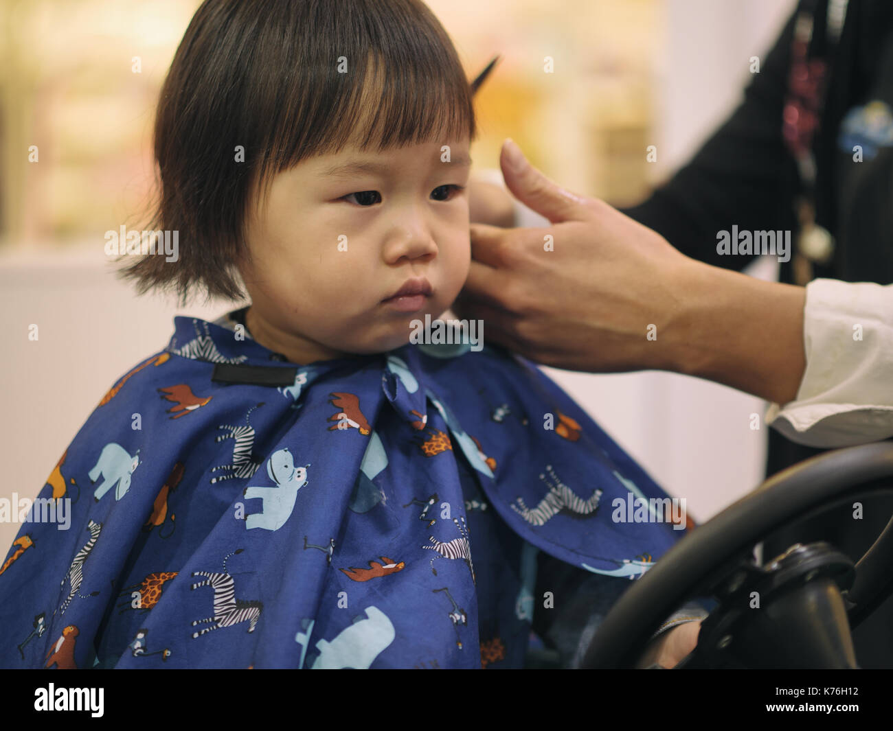 Asian baby girl do hair cut first time in hairdressing shop Stock Photo -  Alamy