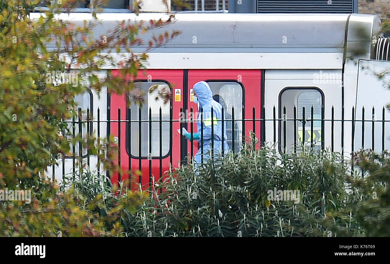 A forensics officer on the platform at Parsons Green station in west London after Scotland Yard declared a terrorist incident following a blast which sent a 'fireball' and a 'wall of flame' through a packed London Underground train. Stock Photo