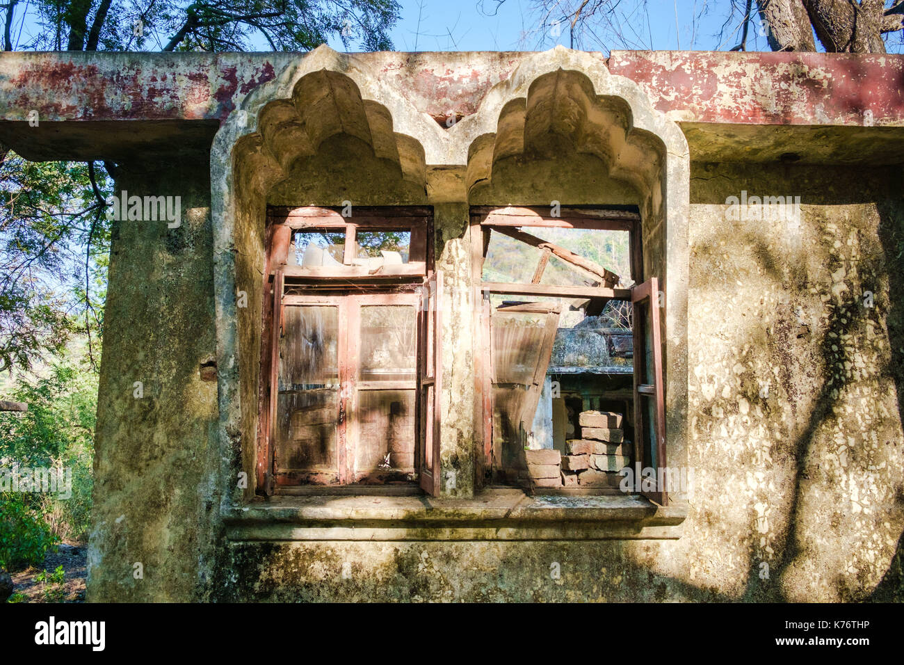 Broken windows of residential building at abandoned Maharishi Mahesh Yogi Ashram (Beatles Ashram). Stock Photo