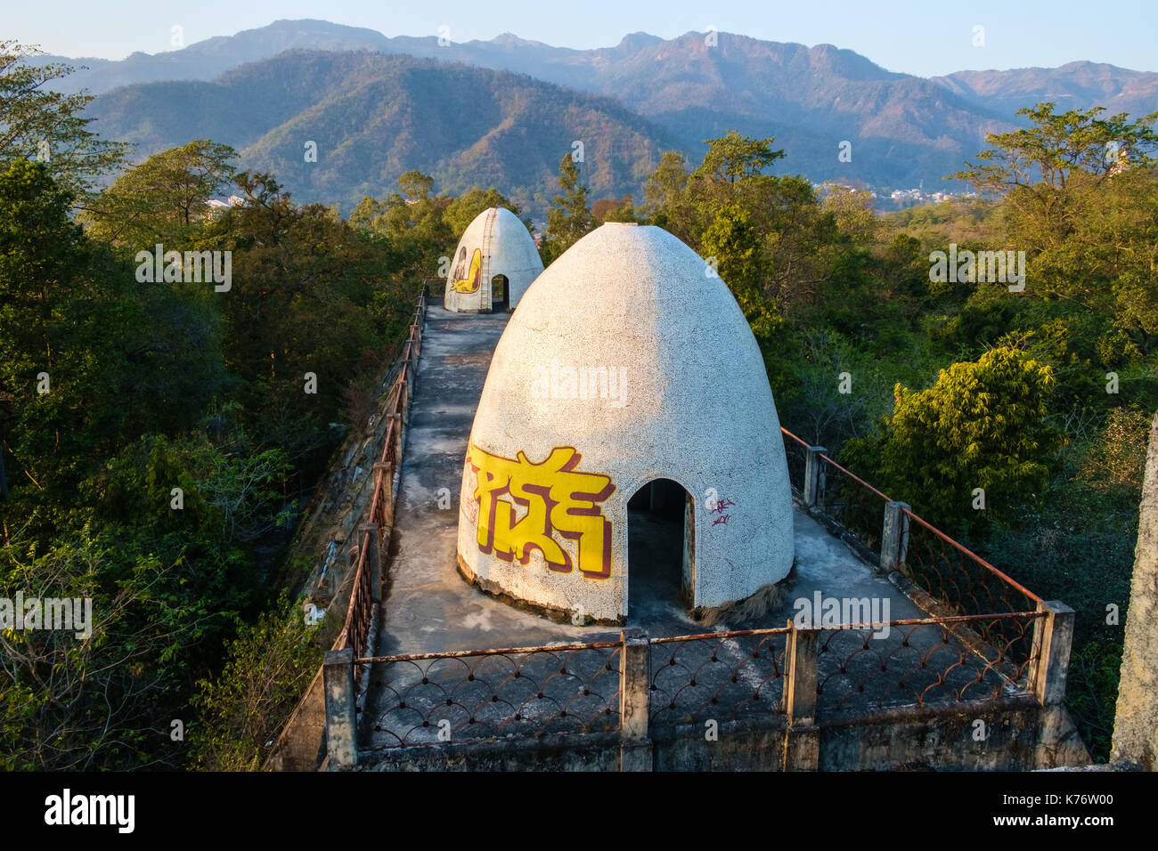Domes painted with graffiti on the roof of residential building of abandoned Maharishi Mahesh Yogi Ashram (Beatles Ashram). Stock Photo