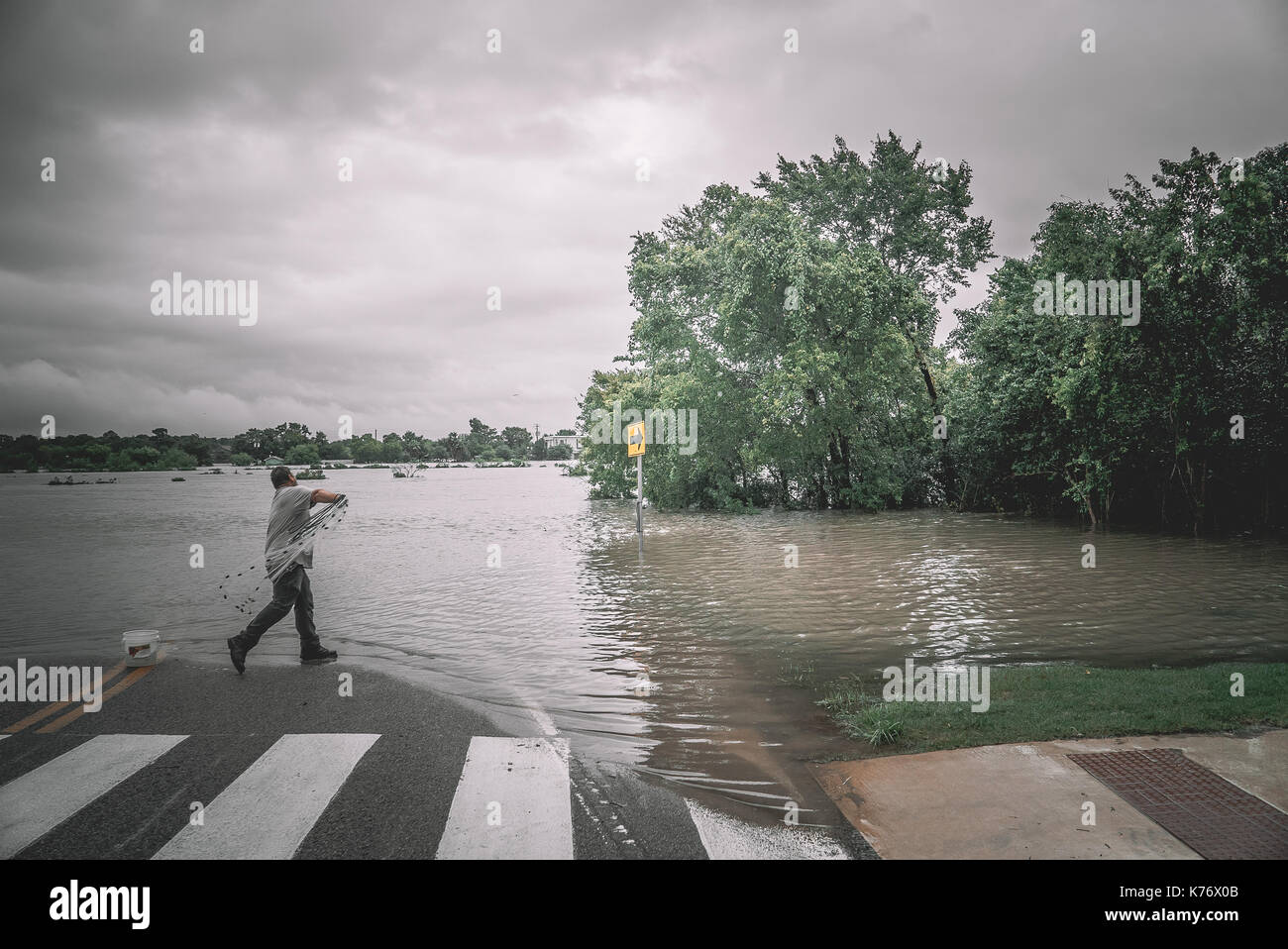 Houston man fishing in flooded street during Hurricane Harvey Stock ...