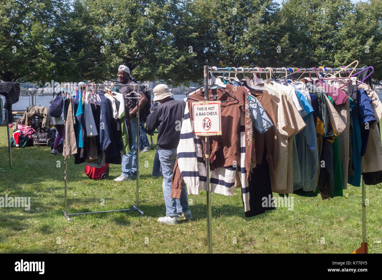 Thrifty shoppers at a free Stop 'N' Swap event in Riverside Park in New York on Sunday, September 10, 2017. GrowNYC's Office of Recycling Outreach and Education sponsored the free event where people can trade reusable, unwanted belongings in exchange for items left by others on a first come, first serve basis.  (© Frances M. Roberts) Stock Photo