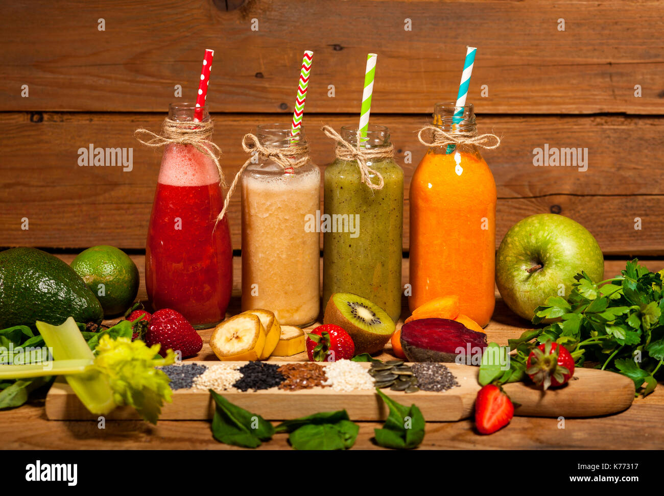 Assortment of fruit and vegetable smoothies in glass bottles with