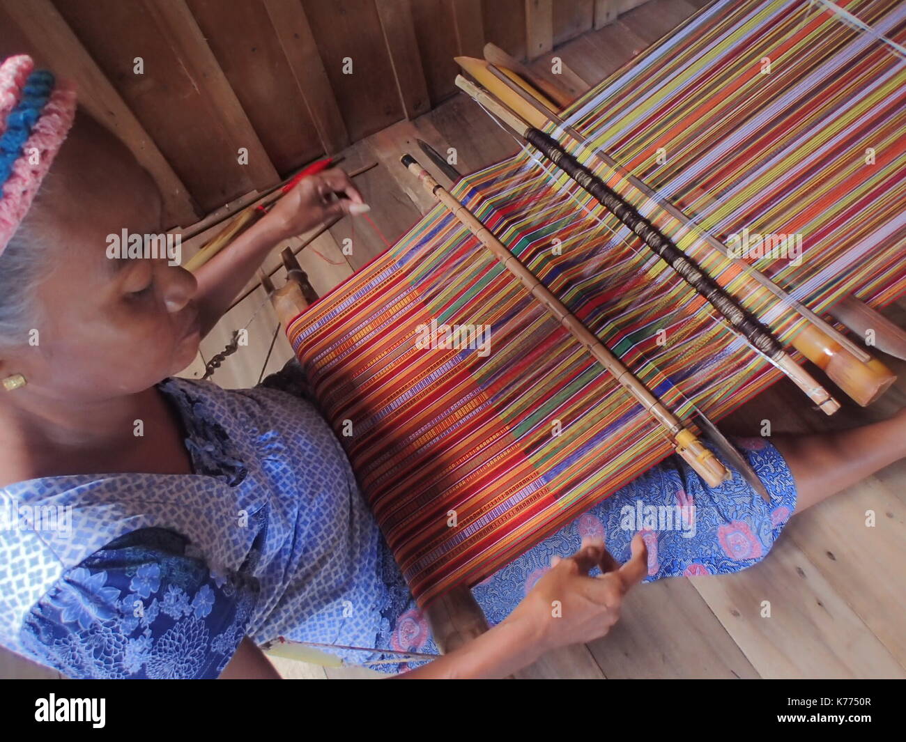 Lamitan City, Philippines. 14th Sep, 2017. Gigi, a 39 years old Yakan woman weaving a 21 meters long cloth. She started weaving when she was 9 years old. The Yakan indigenous people of Lamitan, Basilan are known as intricate weavers of vibrant and colorful single handmade cloths. Jandina, a Yakan woman weaving a 21 meters long cloth. She's been doing this intricate job for more than 25 years. The Yakan indigenous people of Lamitan, Basilan are known as intricate weavers of vibrant and colorful single handmade cloths. Credit: Sherbien Dacalanio/Pacific Press/Alamy Live News Stock Photo