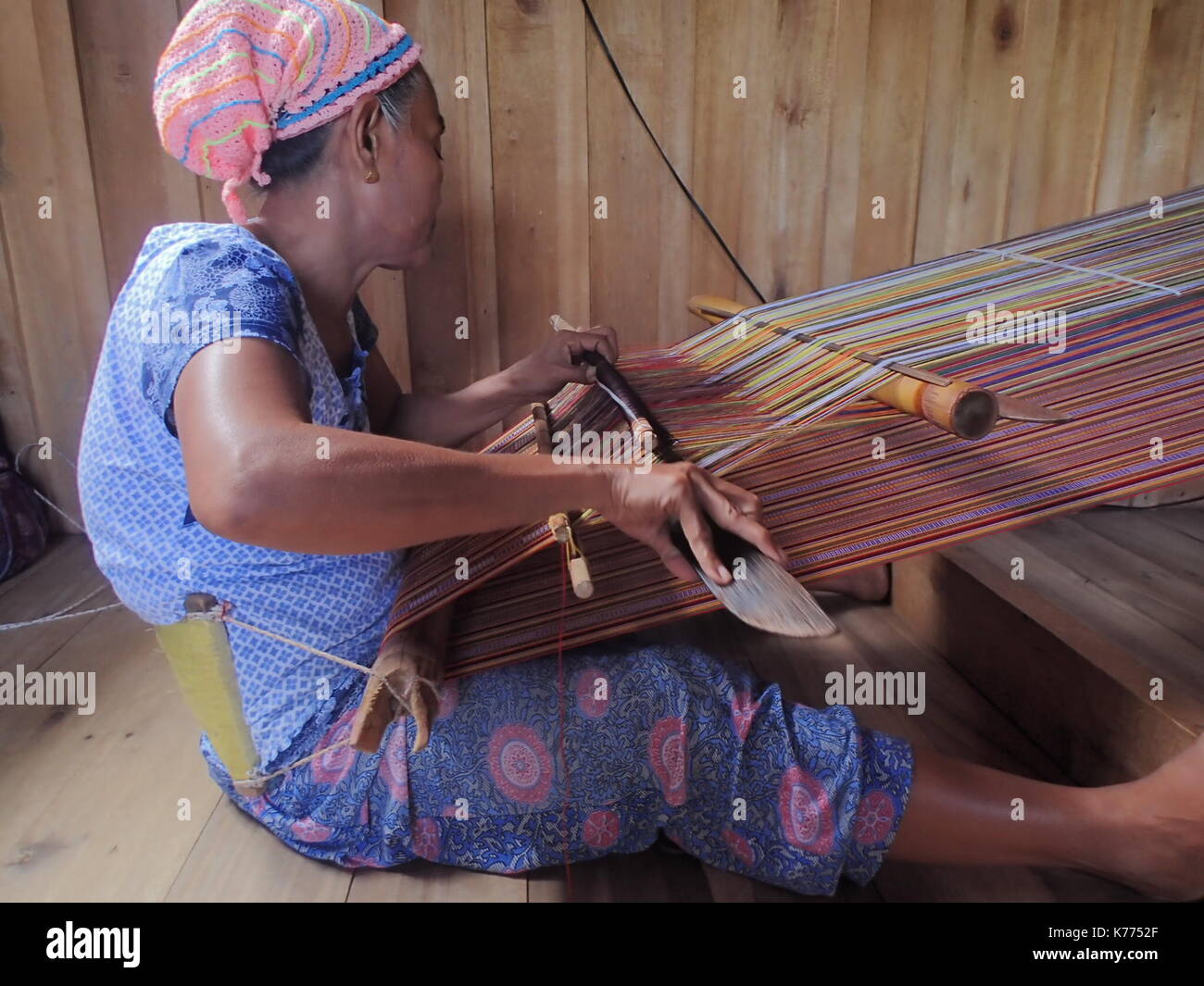 Lamitan City, Philippines. 14th Sep, 2017. The Yakan indigenous people of Lamitan, Basilan are known as intricate weavers of vibrant and colorful single handmade cloths. Jandina, a Yakan woman weaving a 21 meters long cloth. She's been doing this intricate job for more than 25 years. The Yakan indigenous people of Lamitan, Basilan are known as intricate weavers of vibrant and colorful single handmade cloths. Credit: Sherbien Dacalanio/Pacific Press/Alamy Live News Stock Photo
