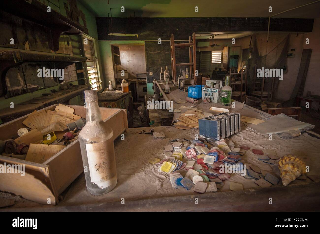 United Kingdom, Montserrat, English-speaking Caribbean, Plymouth, view of the ancient capital, destroyed by pyroclastic flows from the eruption of the stratovolcano of Soufriere Hills in 1997, today prohibited area because of the daily activity of the volcano and its toxic emanations, here the inside of a bar Stock Photo