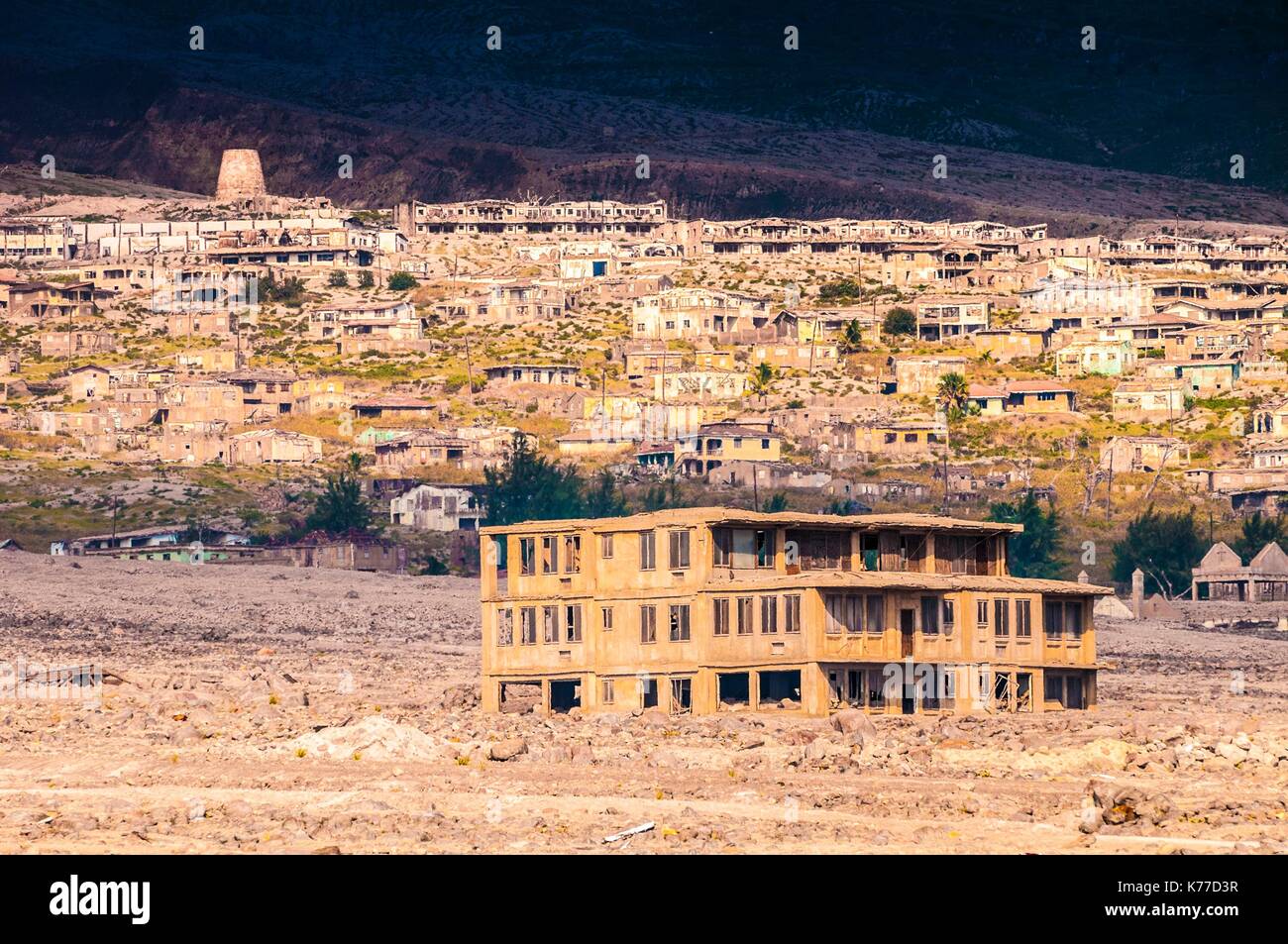 United Kingdom, Montserrat, English-speaking Caribbean, Plymouth, view of the ancient capital, destroyed by pyroclastic flows from the eruption of the stratovolcano of Soufriere Hills in 1997, today prohibited area because of the daily activity of the volcano and its toxic emanations Stock Photo