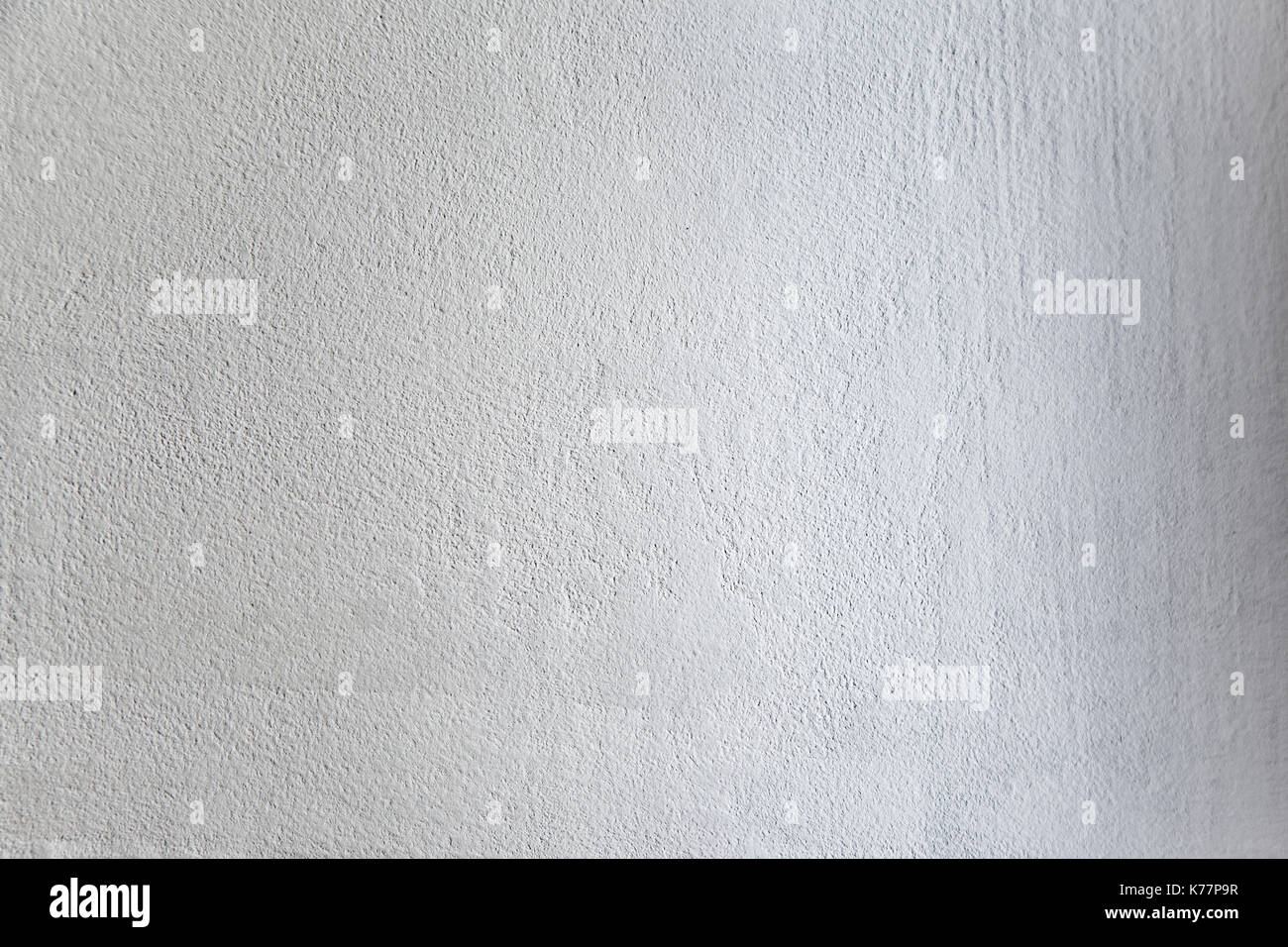 Rough light white colored surface for backgrounds and textures. Stock Photo