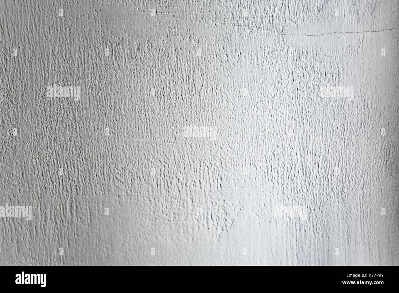 Rough light white colored surface for backgrounds and textures. Stock Photo