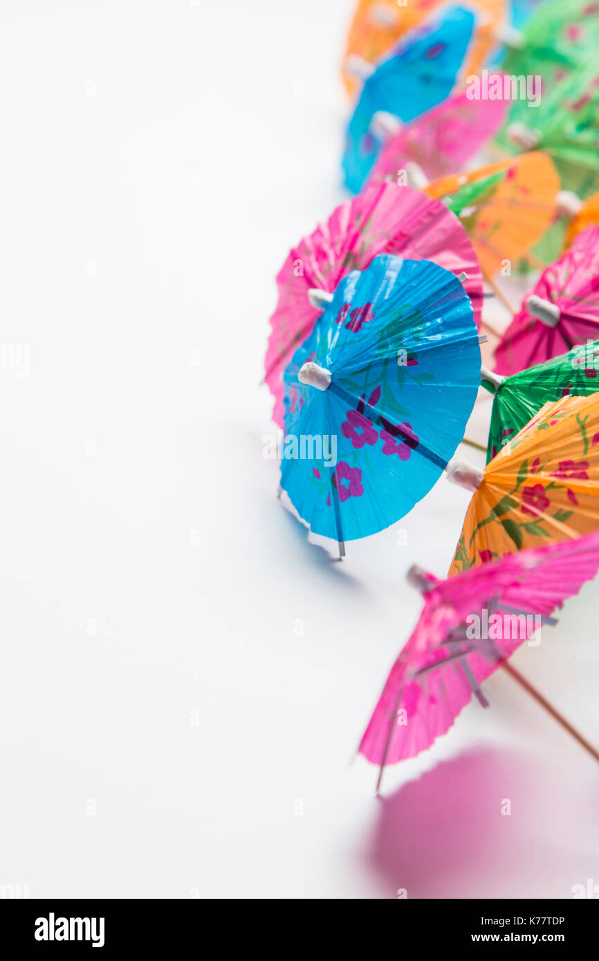Cocktail umbrella summertime background Stock Photo - Alamy