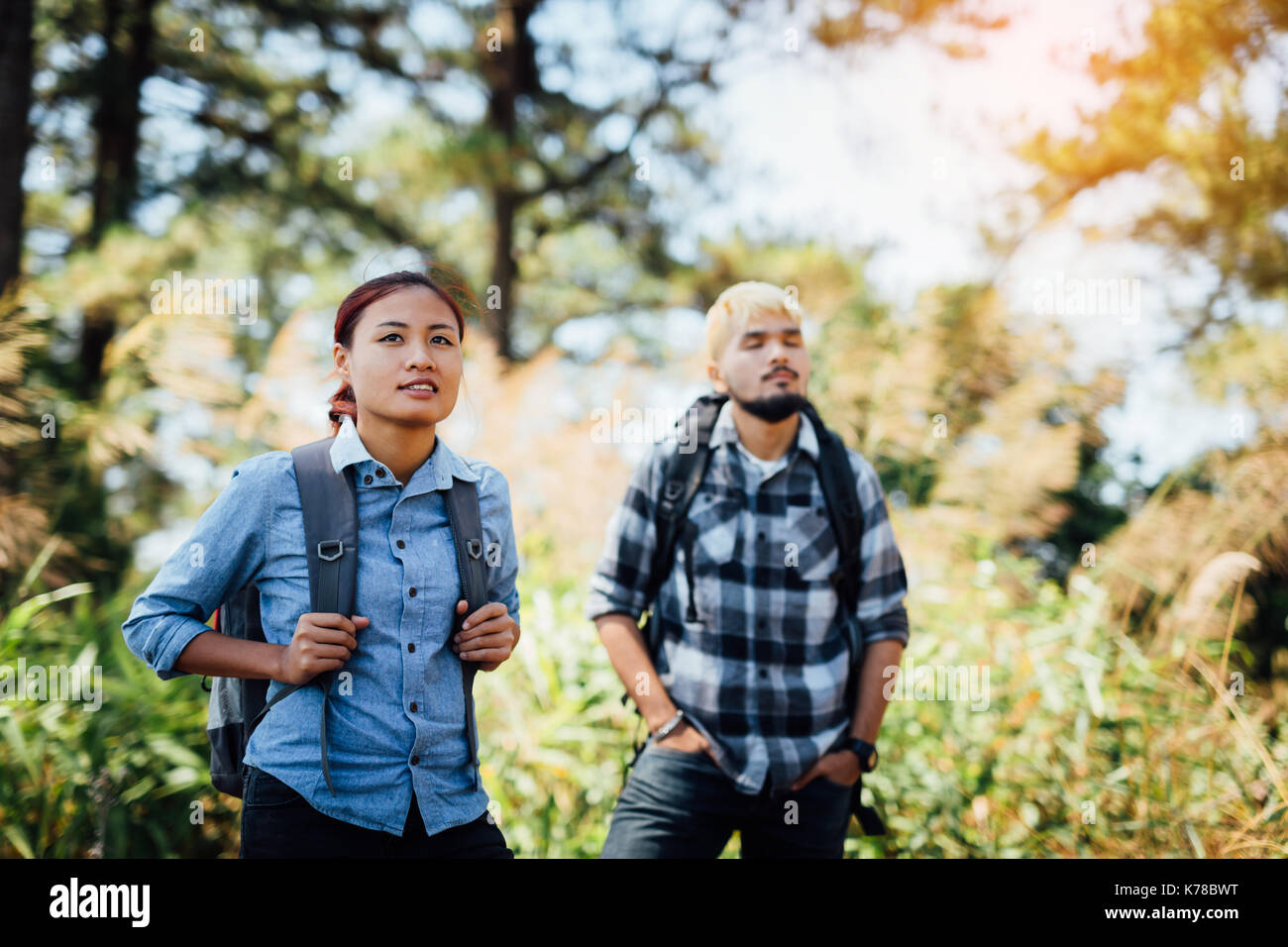 Hiking Young couple with backpack watching trekking map, Hiking concept ...