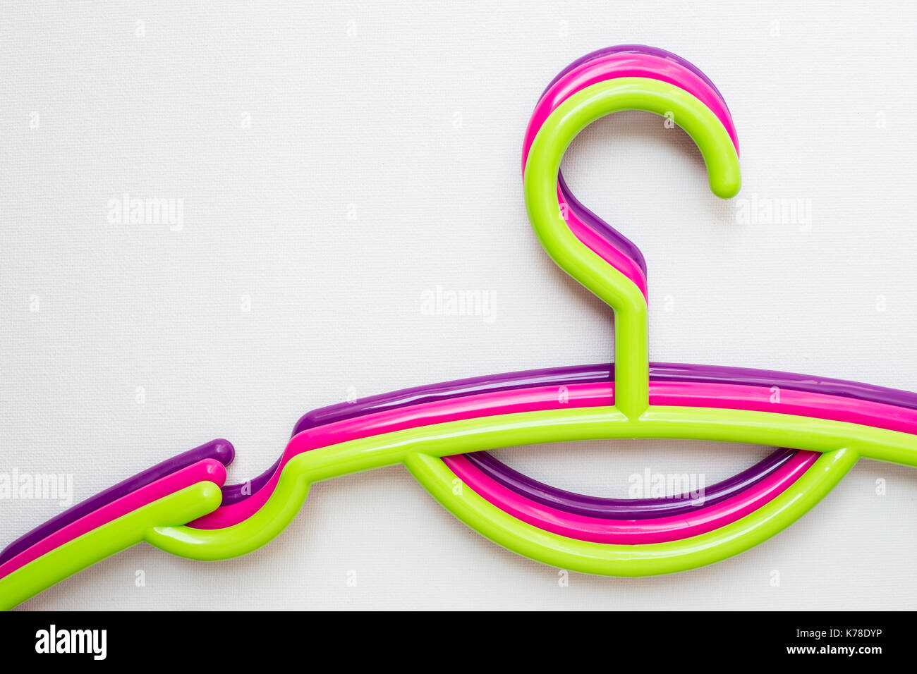 Colourful clothes hanger on white canvas background Stock Photo
