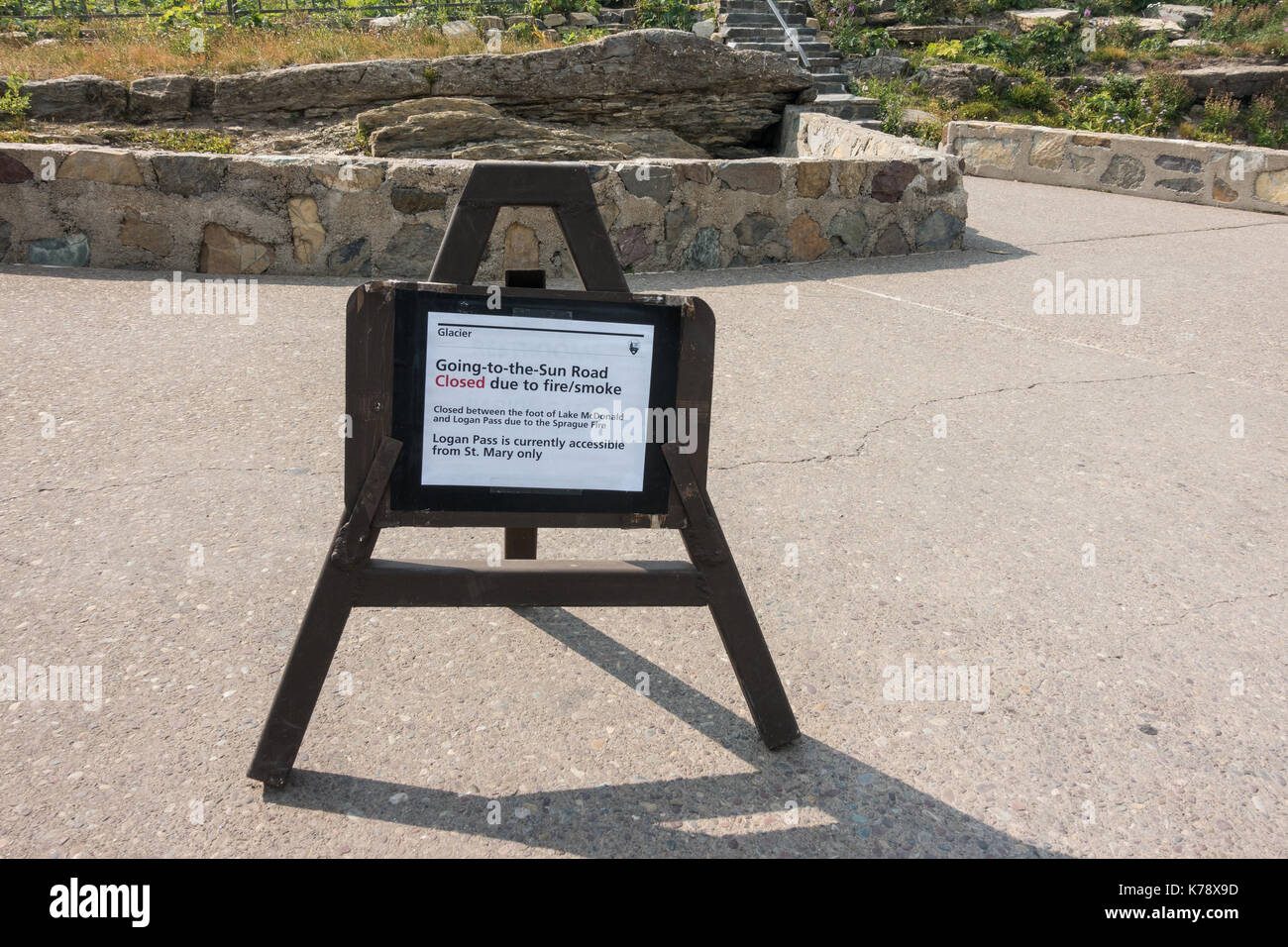 Sign informing visitors to the Glacier National Park of the closure of the Going-to-the-Sun road caused by the wildfire / smoke Stock Photo