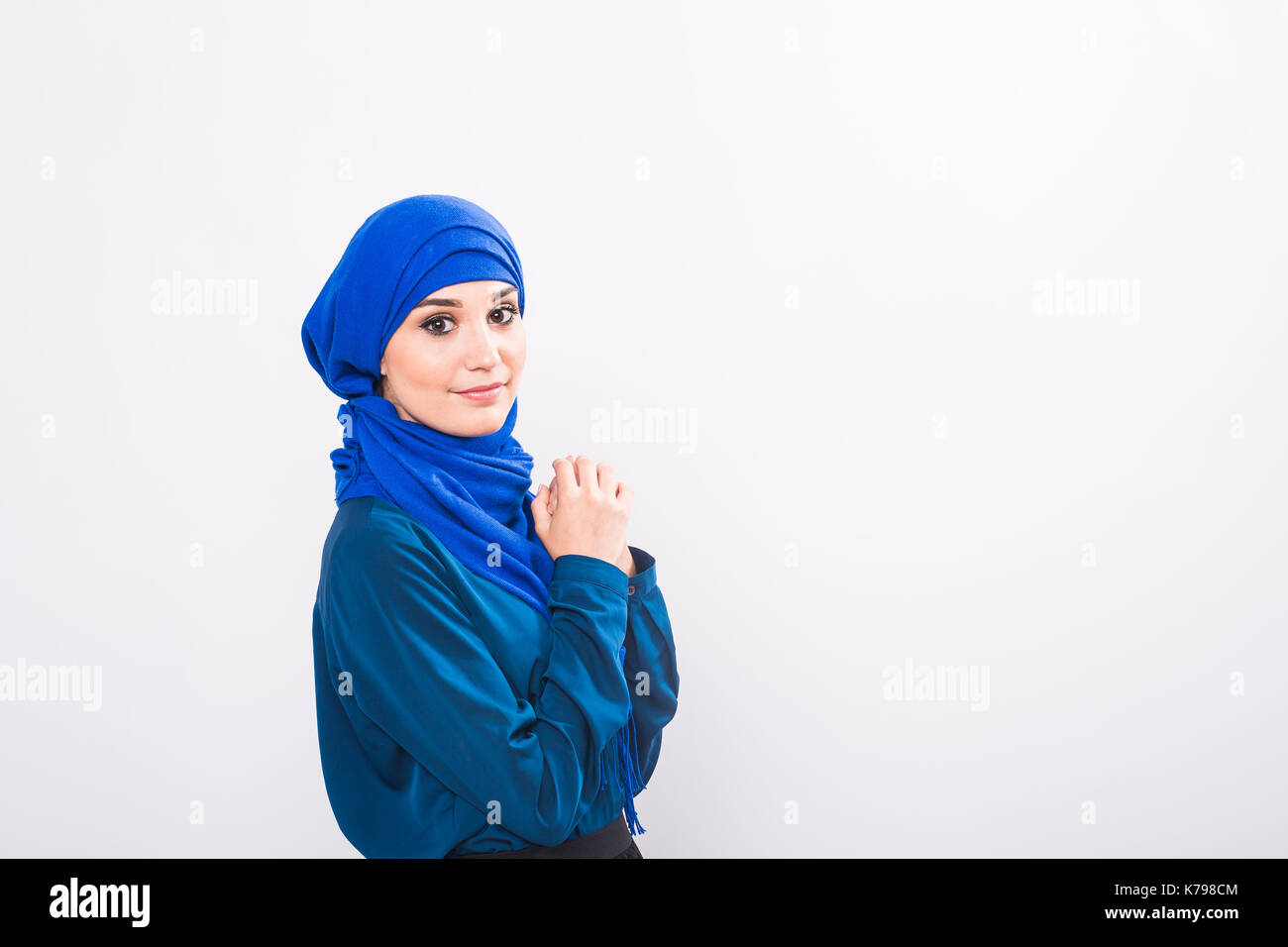 Attractive muslim woman on white background Stock Photo - Alamy