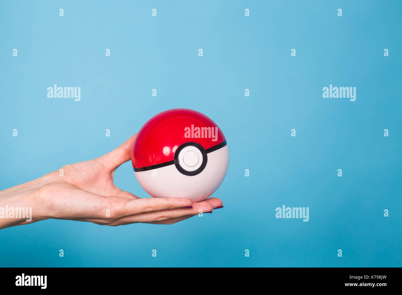 Ufa, Russia July 8, 2017 woman holding pokeball with pikachu