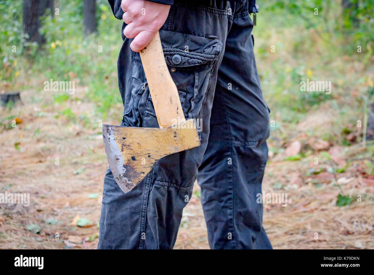 Man holds an axe Stock Photo Alamy