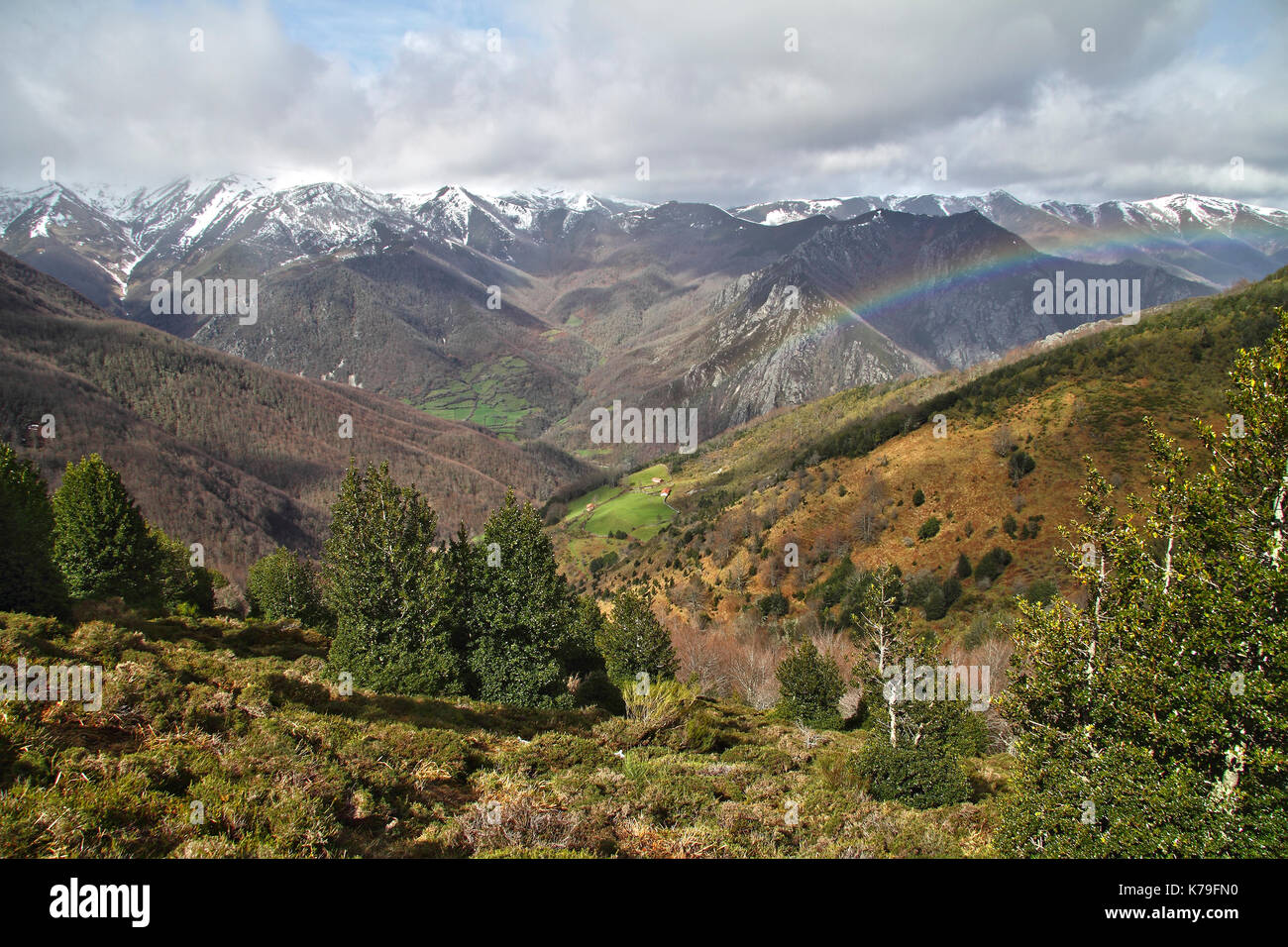 Rainbow over mountains in early spring, Asturias. Spain. Stock Photo