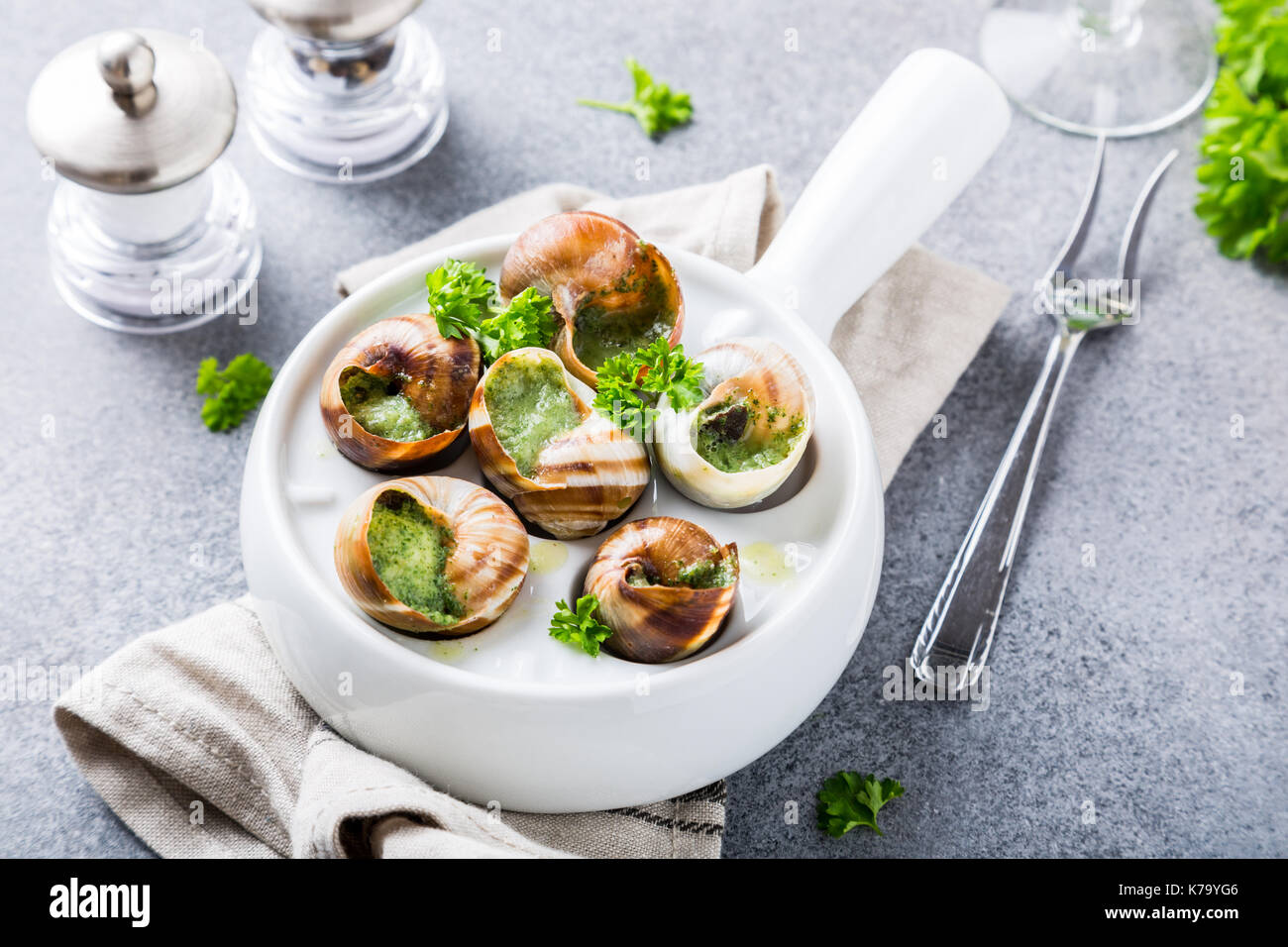 Bourgogne Escargot Snails with garlic herbs butter in white pan on