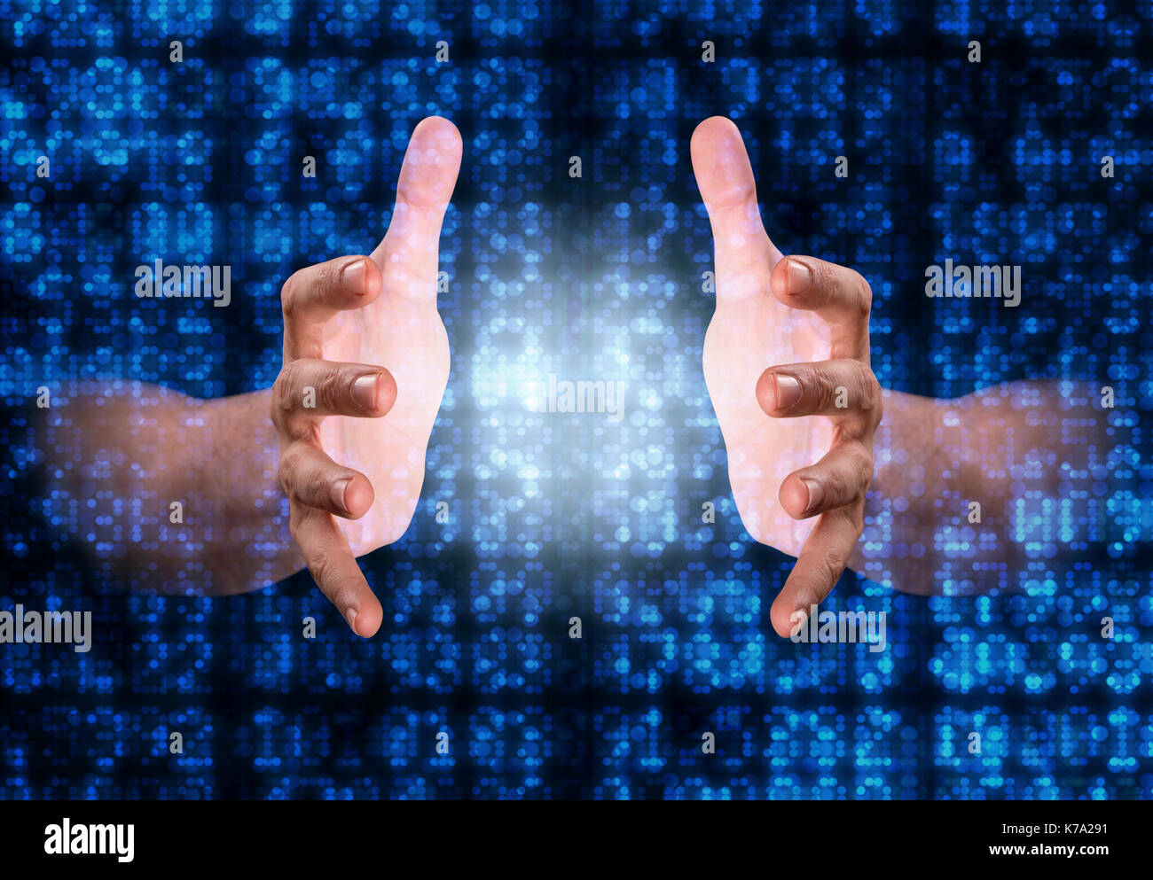A pair of male hands reaching through digital numerical data figures grasping at something in the middle Stock Photo