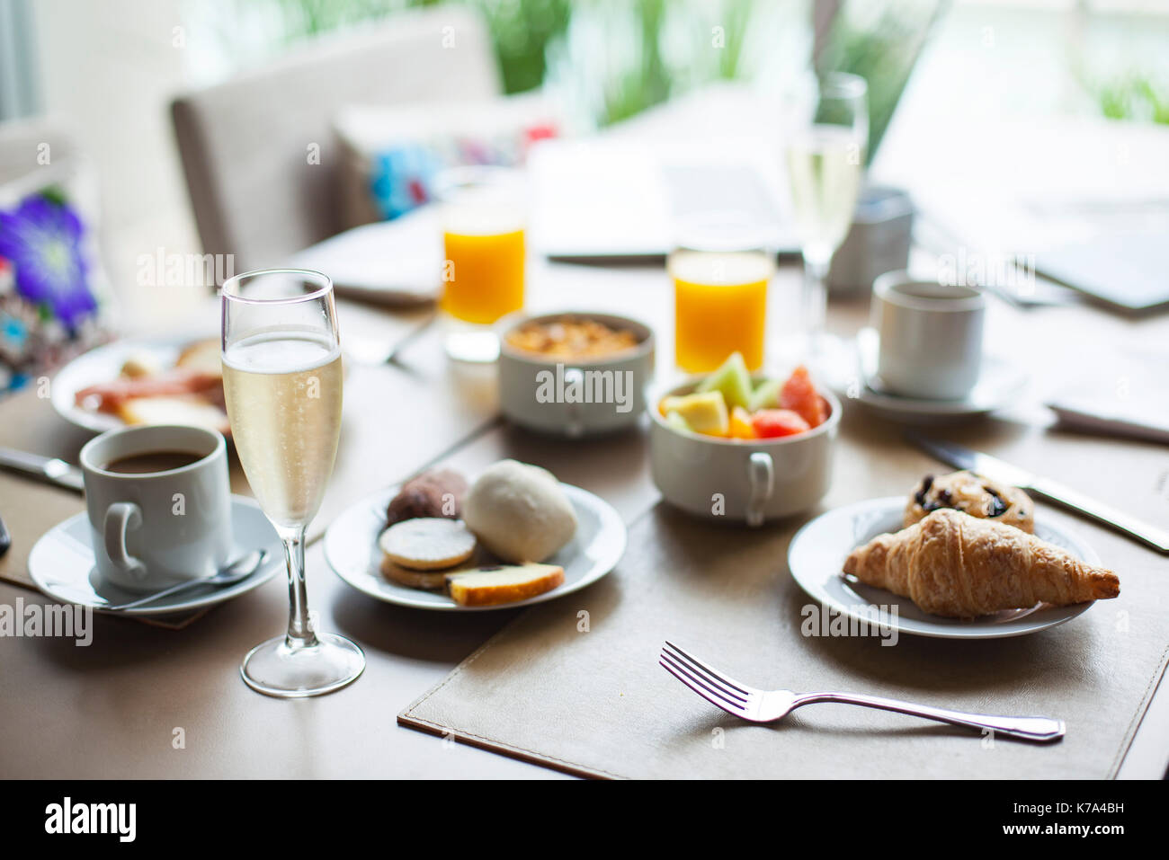 Glass of champagne on breakfast table in restaurant Stock Photo - Alamy