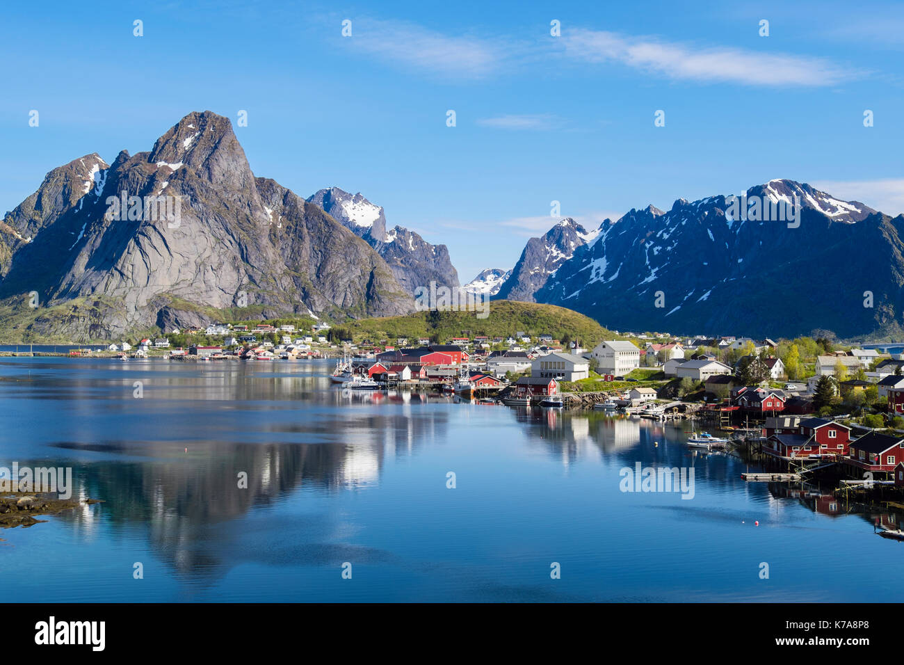 Reflections of mountains in scenic natural fishing harbour in summer. Reine, Moskenes, Moskenesøya Island, Lofoten Islands, Nordland, Norway Stock Photo