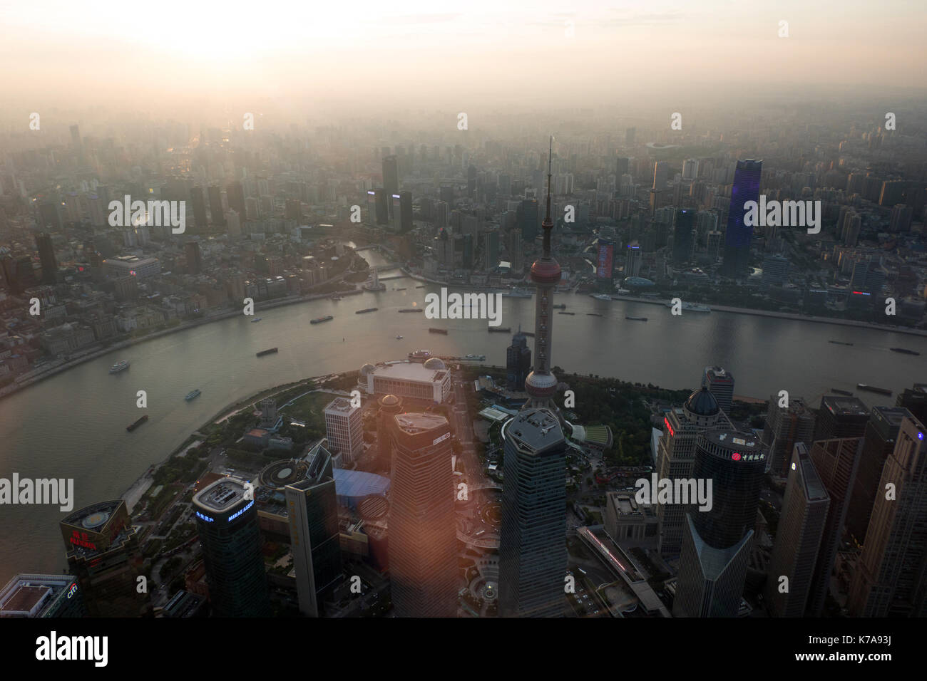 Urban view of The Bund in Shanghai, China, Asia from Shanghai Tower with Huangpu River at sunset. Landscape in Chinese city with modern buildings, sky Stock Photo