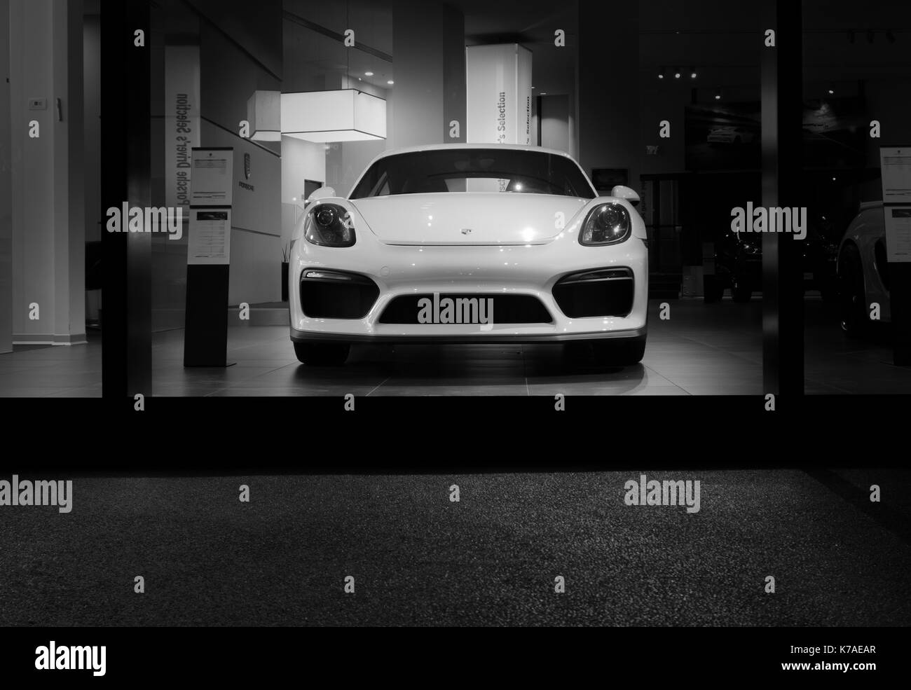 Herzliya, Israel- November, 2017: White Porsche 911 Carrera 4 car stands parked on the stage. Front view, in the night Stock Photo