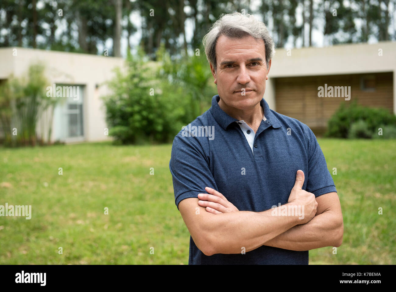 Mature man with arms folded across chest, portrait Stock Photo